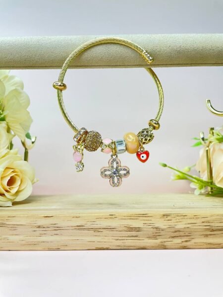 Pulsera Pandora dorada Flor y corazón de ojito